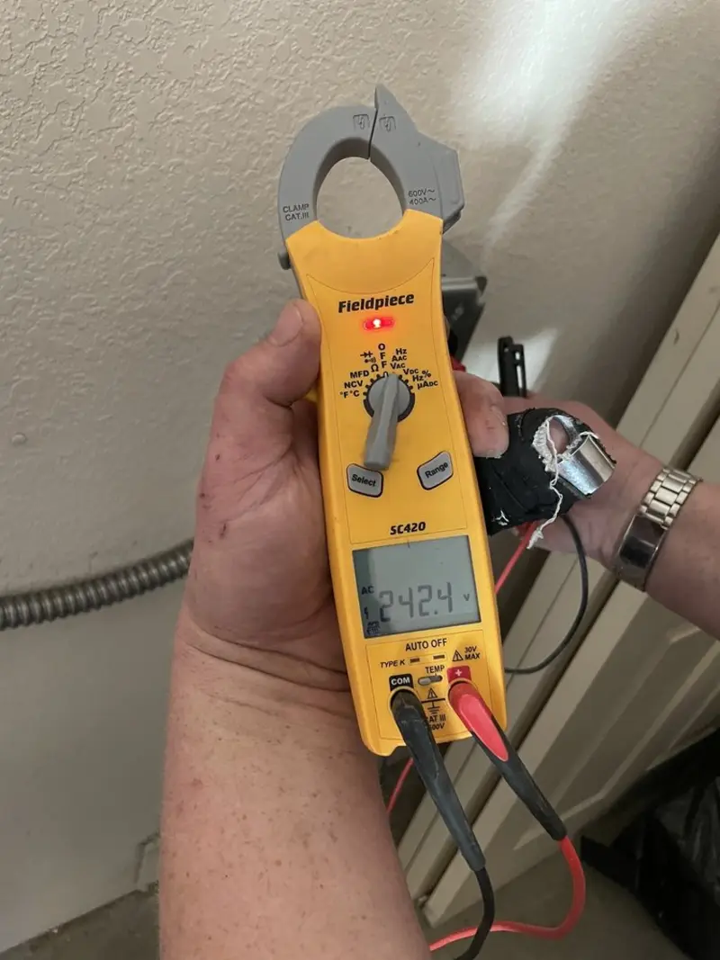 Voltage testing with clamp meter during Ceiling Fan Installation in Buena Vista